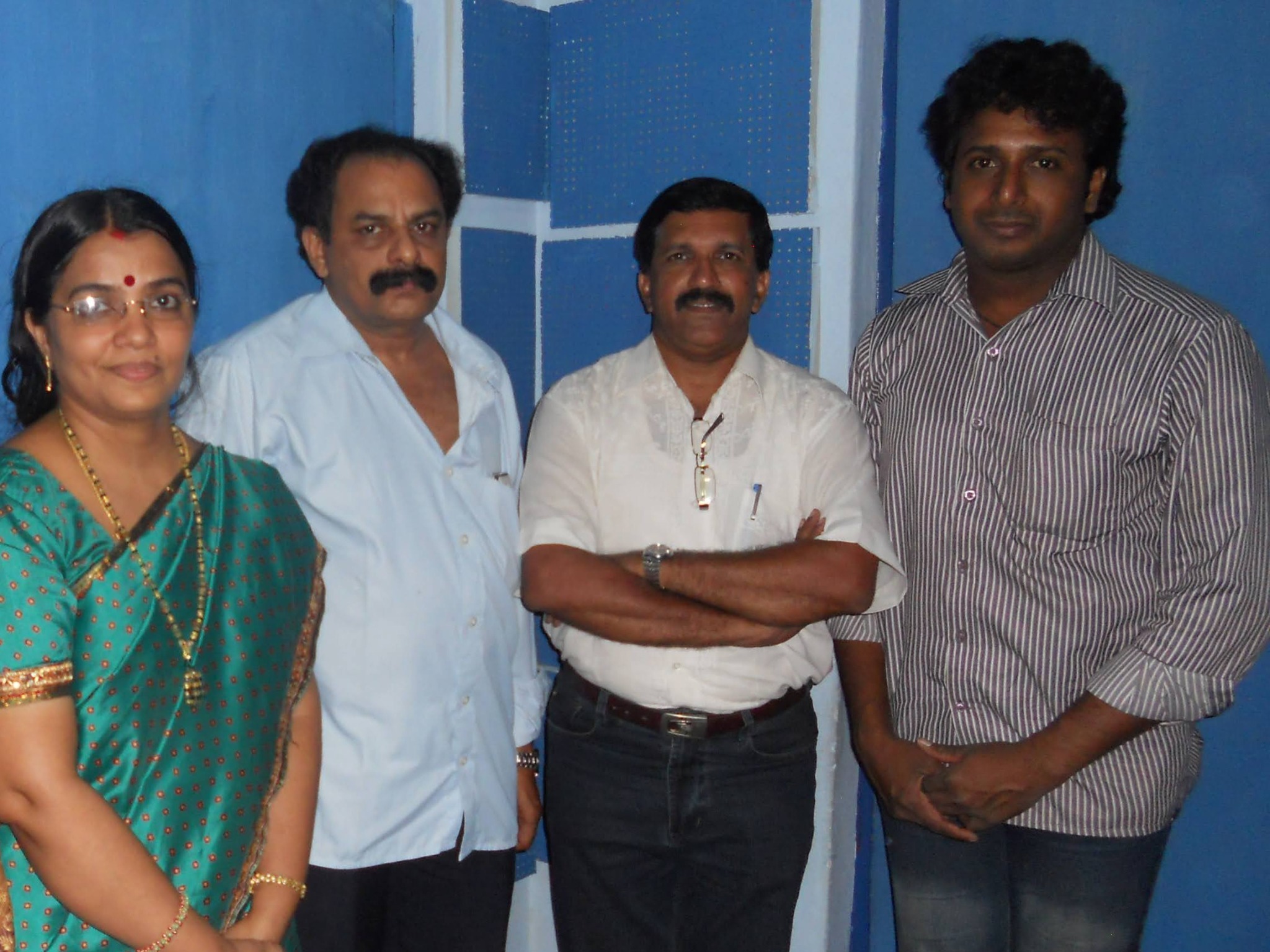 With friends at the recording studio